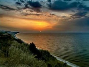 Scenic view of sea at sunset