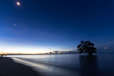 Scenic view of sea against sky at night