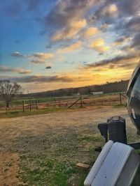 Scenic view of field against sky during sunset