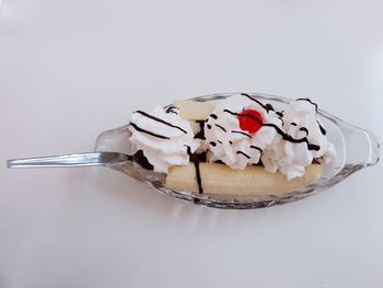 Close-up of cake on table against white background