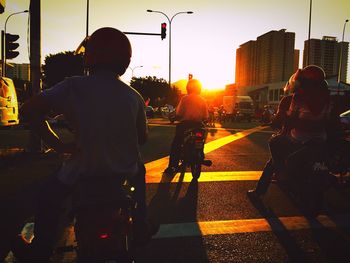 People on city street during sunset