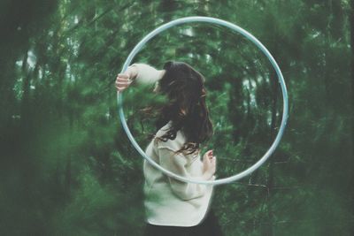 Woman holding hula hoop