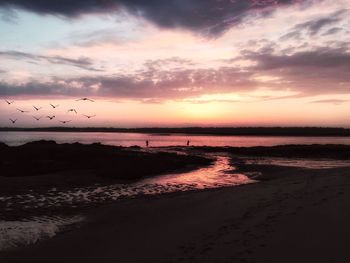Scenic view of sea against cloudy sky
