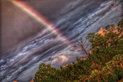 Scenic view of rainbow against sky at night