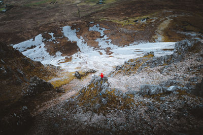 Aerial view of person standing on mountain