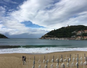 Scenic view of sea against cloudy sky