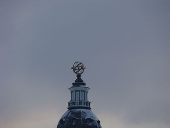 Low angle view of statue against sky