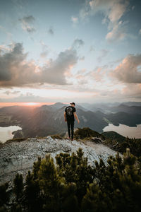 Man standing on mountain against sky