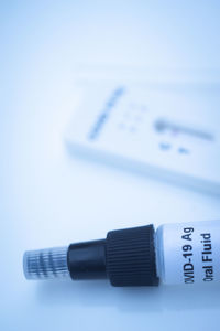 Close-up of computer keyboard on table against white background