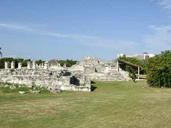 Built structure on field against sky