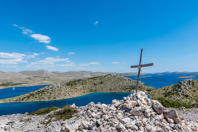 Scenic view of rocks against blue sky