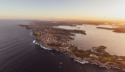 Drone view of south head, watsons bay with sydney harbour, cbd and harbour bridge in the background