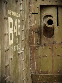 Close-up of text on wooden door