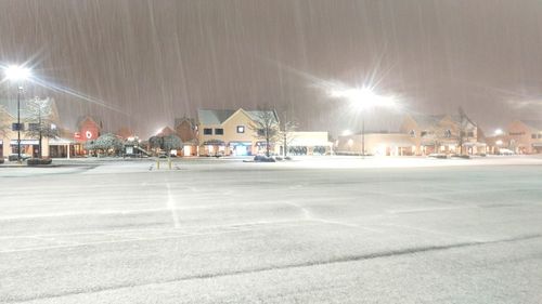 Illuminated city at night during winter