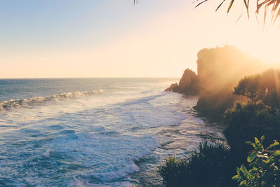 Scenic view of sea against clear sky during sunset