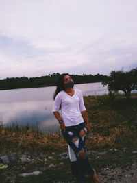 Full length of man standing on land against sky