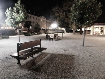 Empty bench in front of building