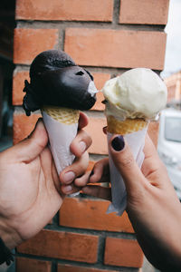 Cropped image of hand holding ice cream cone