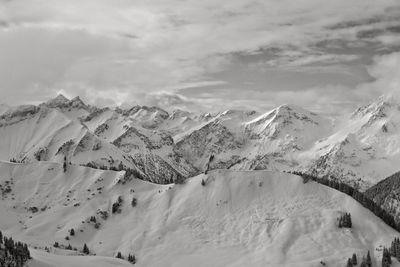 Scenic view of snowcapped mountains against sky