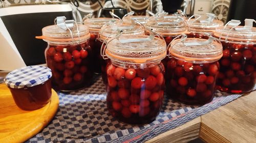 Close-up of fruits in glass jar on table