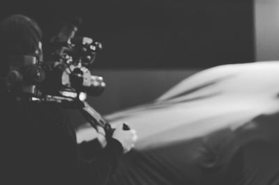 Close-up of man photographing car
