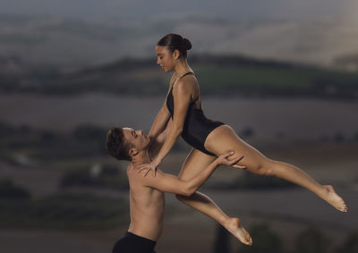 Ballet dancer dancing outdoors