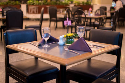 Empty chairs and table in restaurant