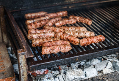 High angle view of meat on barbecue grill