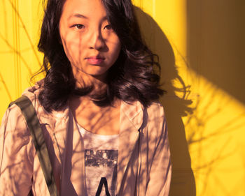 Portrait of smiling young woman at home