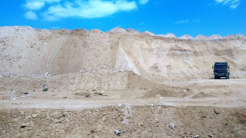 Brick wall against blue sky