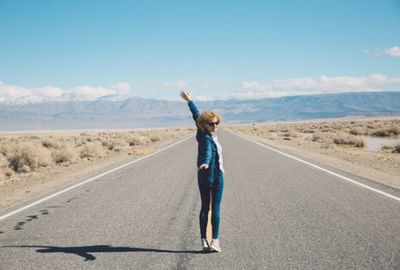 Full length of a man walking on road