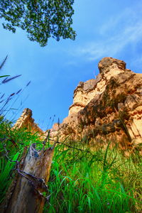 Low angle view of rock formation against sky