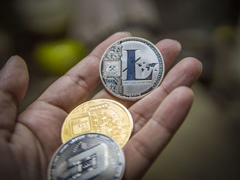 Close-up of hand holding eyeglasses