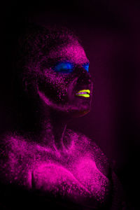 Woman with eyes closed in neon make-up