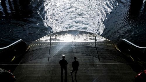 Reflection of people in water