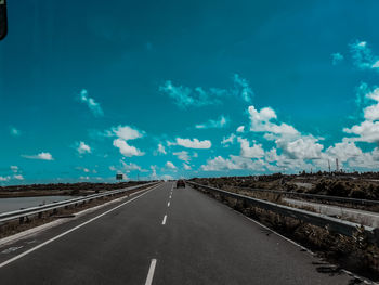 View of road against blue sky