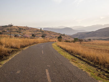 Road amidst landscape against sky