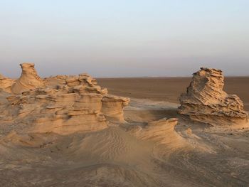 Rock formation on land against sky