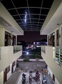People in modern building at night