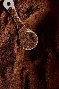 Close-up of ground coffee  in container