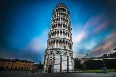 Low angle view of leaning tower of pisa against cloudy sky