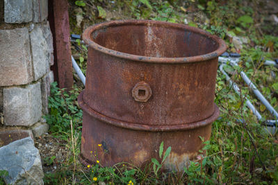 Close-up of old rusty metal on field