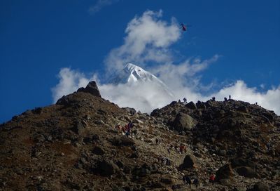 Low angle view of rock formation against sky