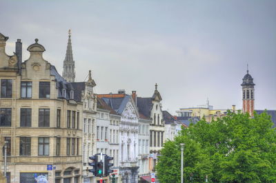 Buildings in city against sky