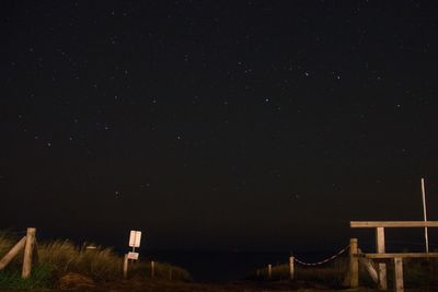 Scenic view of landscape against sky at night