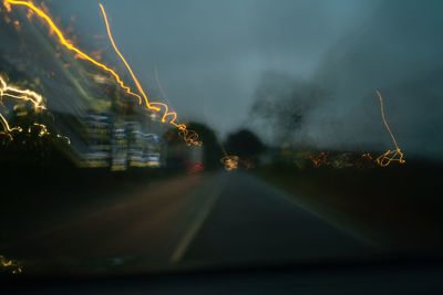 Blurred motion of car on road in city