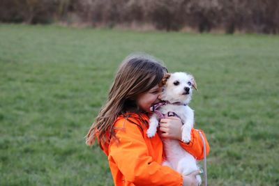 Close-up of dog on field