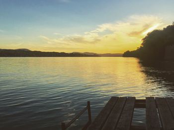 Scenic view of lake against sky during sunset