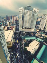 High angle view of buildings in city against sky