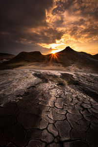 Scenic view of landscape against sky during sunset